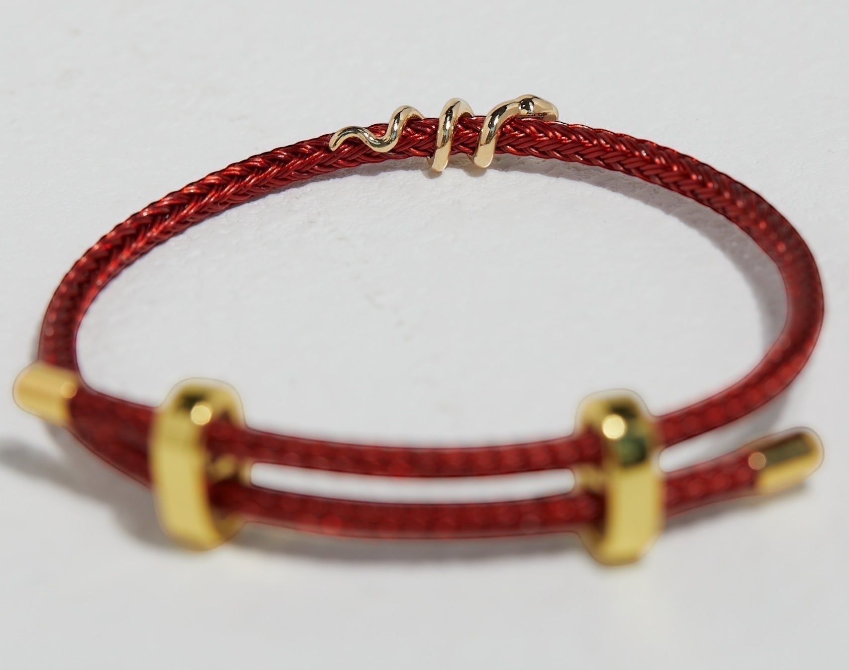 BoxUnboxed 18k solid gold snake bracelet with diamond on red string cord, adjustable fit.