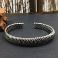 BoxUnboxed Nordic Frost Artisan Braided Silver Cuff. Solid 925 sterling silver, 35g, open cuff style with intricate braided texture and polished borders.
