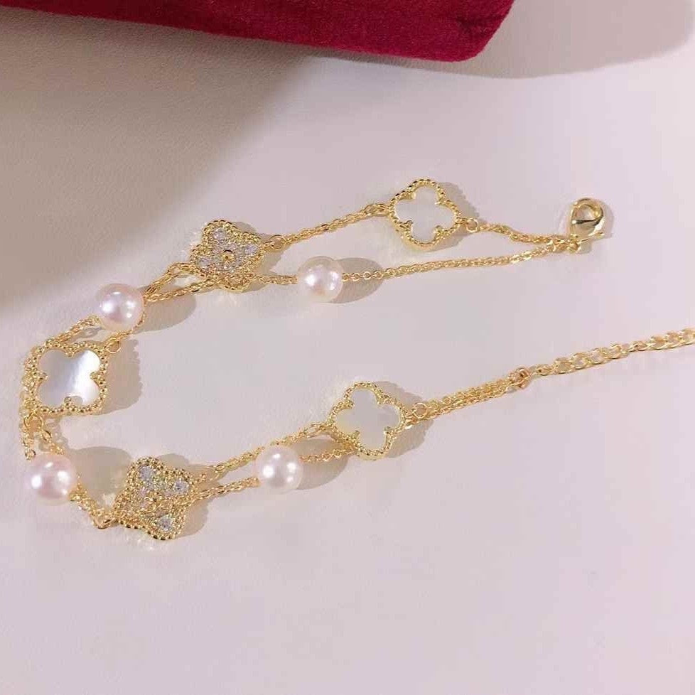 BoxUnboxed Classic Clover Double-Layer Pearl Bracelet with gold-plated finish, white freshwater pearls, and clover charms.