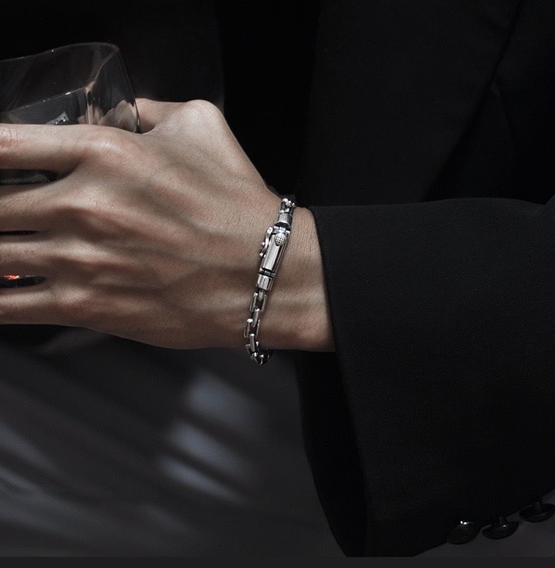 BoxUnboxed Kinetic Box Chain bracelet in solid 925 sterling silver with a dual-lock safety clasp and oxidized industrial accents.