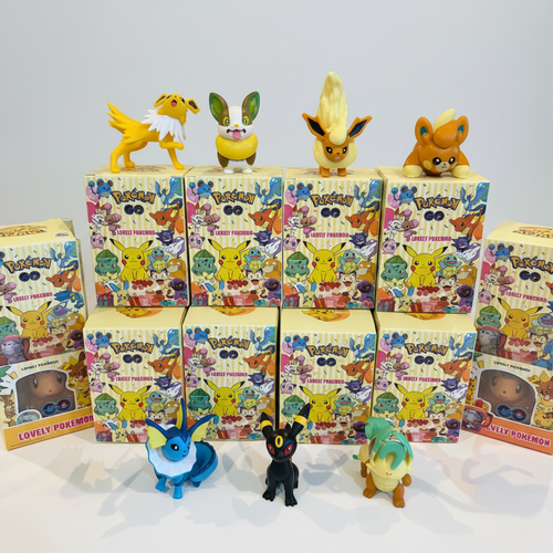 A collection of Pokémon Mystery Box blind boxes with various character figures displayed on top and in front, set against a plain light gray background.